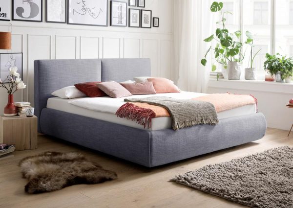 Luxe design bed met comforthoogte in blauw. 160 x 200